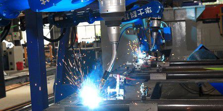 Robot welding according to program
